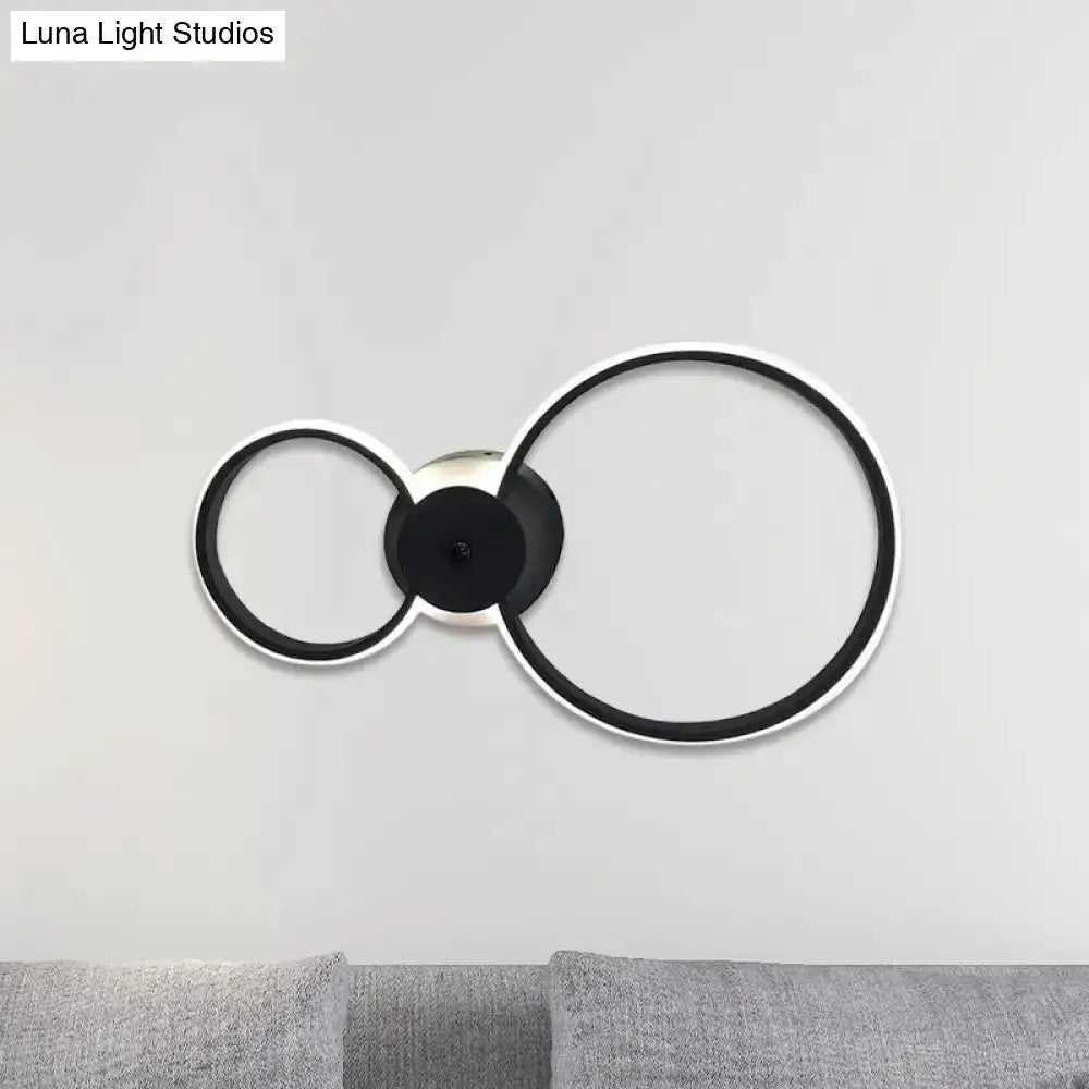 Modern black and silver LED hoop wall lamp with three connected rings by Decorbites on Tampa Home & Garden Store