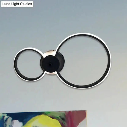 Decorbites LED hoop wall lamp, black and silver, with two circular rings, wall-mounted on Tampa Home & Garden Store