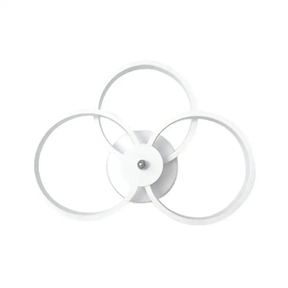 White LED hoop wall lamp with three overlapping circular rings, modern bedroom decor on Tampa Home & Garden Store