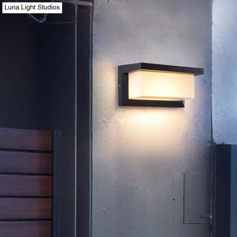 Black sound activated wall sconce with black frame and frosted rectangular shade by Decorbites on Tampa Home & Garden Store