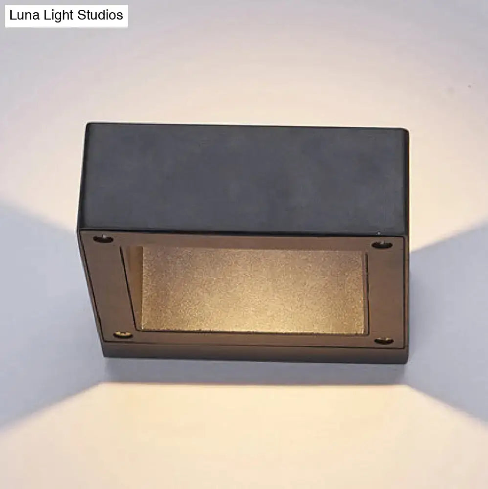 Black square LED sconce by Decorbites, wall-mount with warm downward glow on Tampa Home & Garden Store