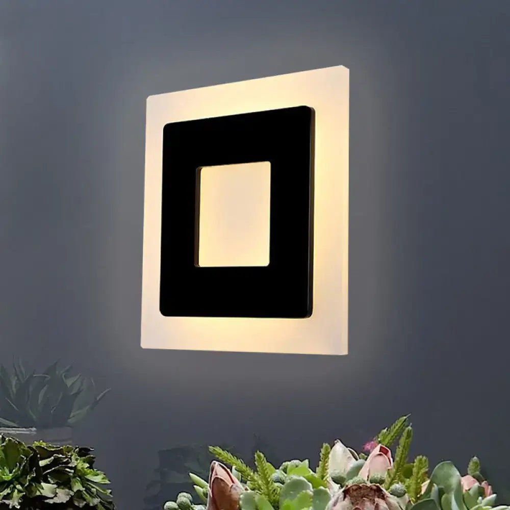 Decorbites black square wall sconce with white outer frame, modern geometric design on Tampa Home & Garden Store