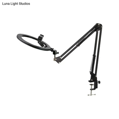 Black swing-arm mirror light with circular ring and adjustable clamp base on Tampa Home & Garden Store