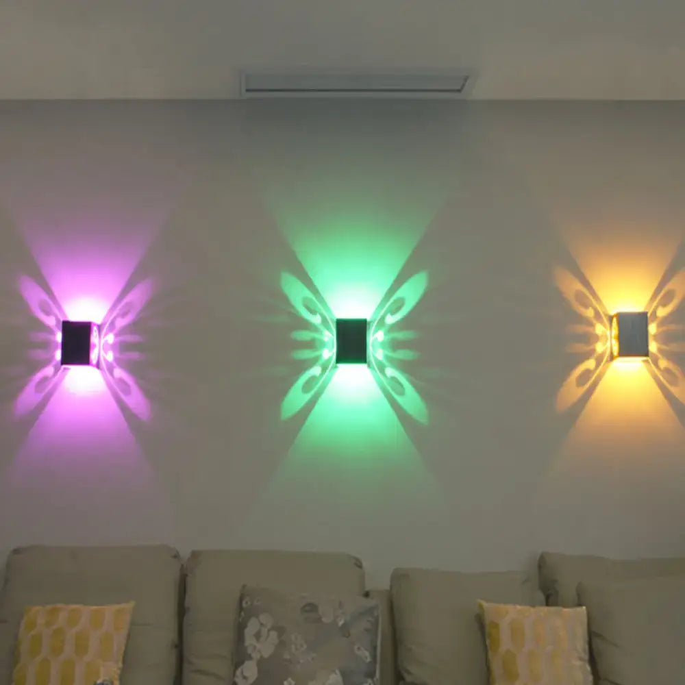 Black Swirl LED Sconce by Decorbites; trio of color-changing purple/green/amber wall projections on Tampa Home & Garden Store