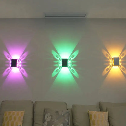 Black Swirl LED Sconce by Decorbites; trio of color-changing purple/green/amber wall projections on Tampa Home & Garden Store