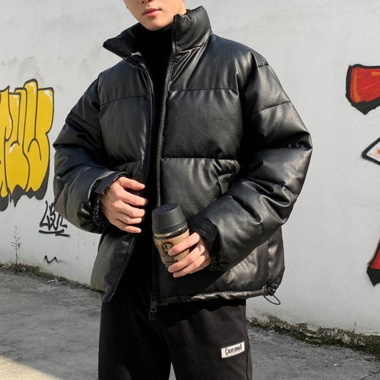 Stevvex black oversized puffer jacket worn by a man, padded warmth, holding coffee on Tampa Home & Garden Store