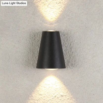 Modern black trapezoid outdoor wall light sconce with upward and downward glow Decorbites on Tampa Home & Garden Store