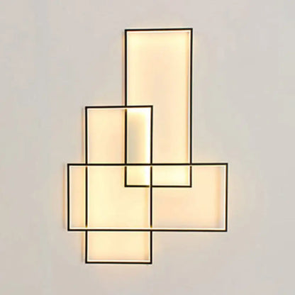 Black acrylic wall sconce Decorbites with stacked rectangular panels and warm backlit glow on Tampa Home & Garden Store
