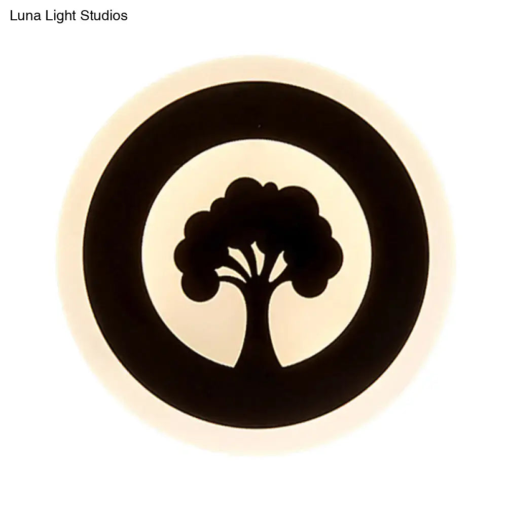 Black Pattern Wall Sconce with circular glow and tree silhouette by Decorbites on Tampa Home & Garden Store