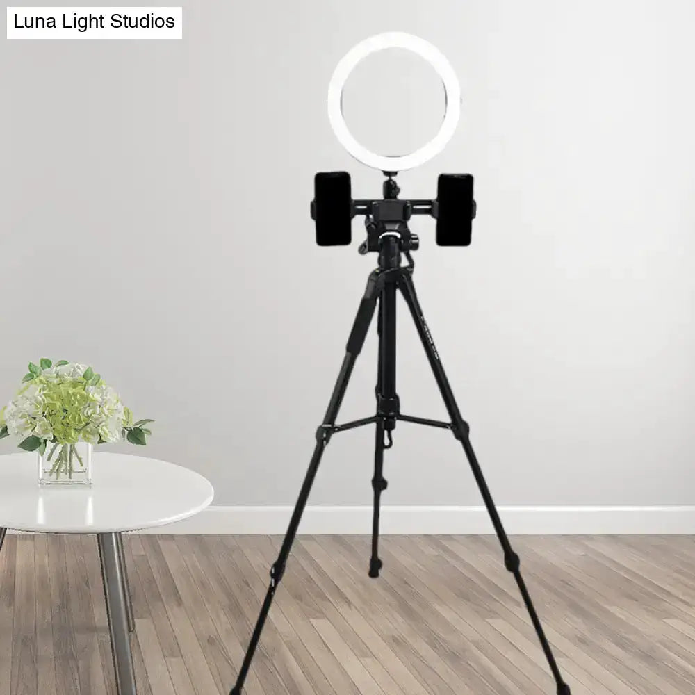 Ring light on a black tripod with adjustable stand in a minimal room on Tampa Home & Garden Store