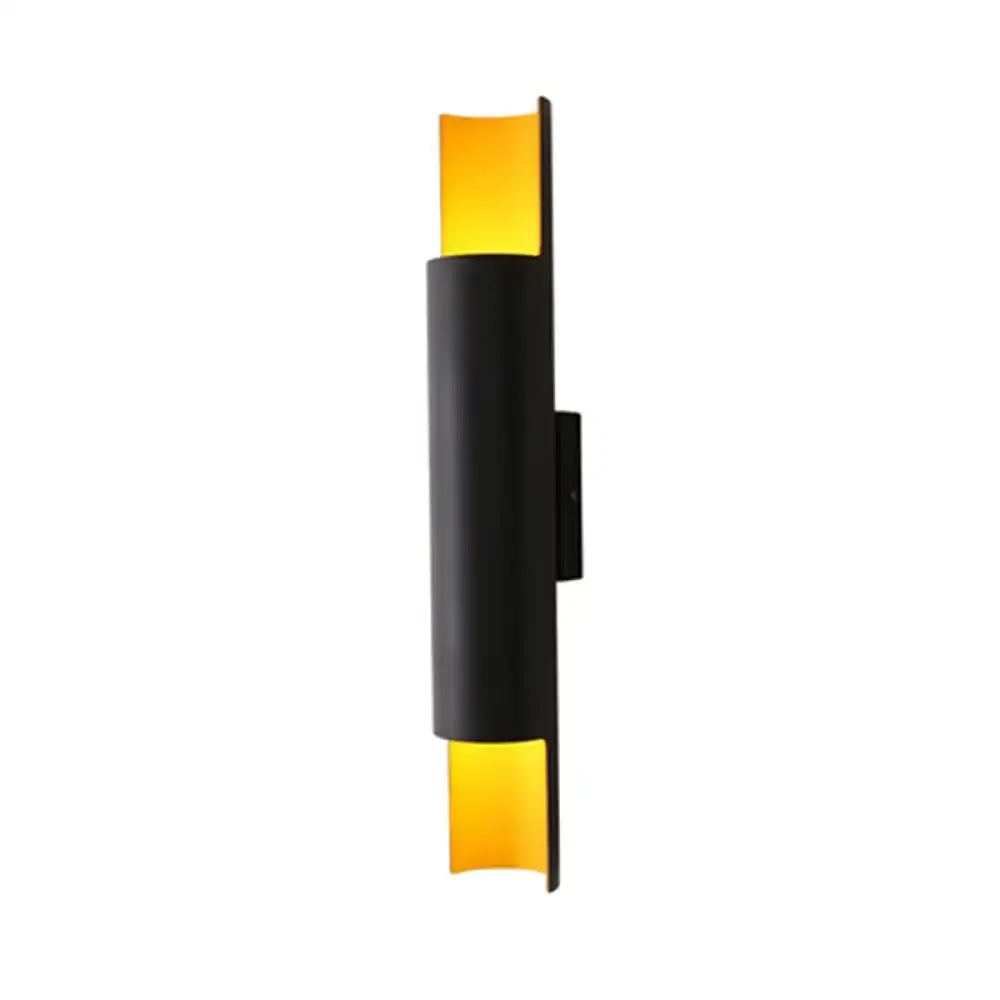 Black tubular wall lamp sconce by Decorbites with amber glass ends on Tampa Home & Garden Store