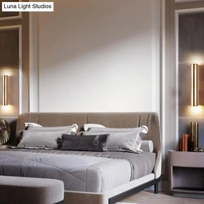 Pair of Decorbites black tubular wall lamps flanking a bed in a modern bedroom on Tampa Home & Garden Store