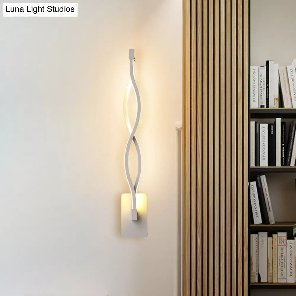 Decorbites Black Twisted LED Sconce with metal arms and warm glow on wall backplate on Tampa Home & Garden Store