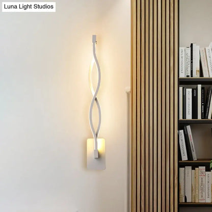 Decorbites Black Twisted LED Sconce with metal arms and warm glow on wall backplate on Tampa Home & Garden Store