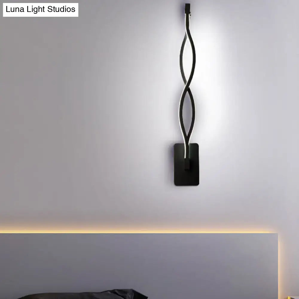 Black twisted LED sconce wall light with dual looping metal arms on Tampa Home & Garden Store