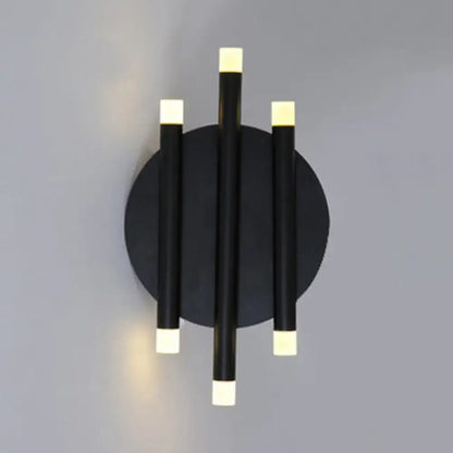 Black round wall sconce with three vertical cylinders on a circular backplate, LED square ends on Tampa Home & Garden Store