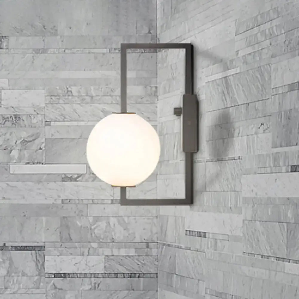 Black White Orb Wall Sconce by Decorbites, black metal frame with frosted white glass orb on Tampa Home & Garden Store