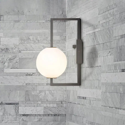 Black White Orb Wall Sconce by Decorbites, black metal frame with frosted white glass orb on Tampa Home & Garden Store