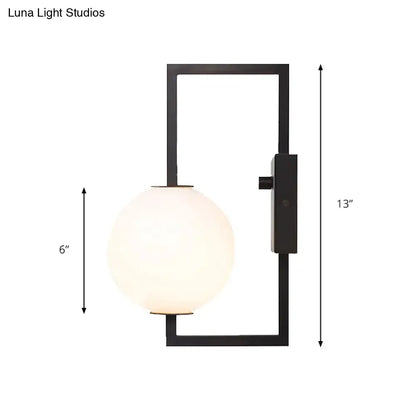 Black White Orb Wall Sconce by Decorbites with black metal frame and white glass orb on Tampa Home & Garden Store