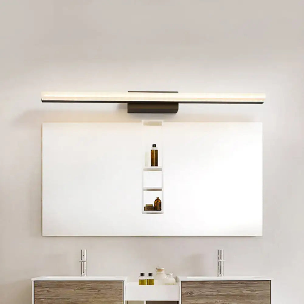 Black linear curved bar bathroom sconce over white vanity mirror, metal finish on Tampa Home & Garden Store