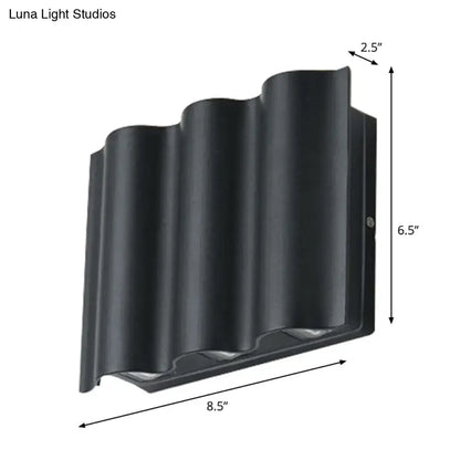 Decorbites black wavy metal wall sconce 8.5in wide 6.5in tall 2.5in depth on Tampa Home & Garden Store