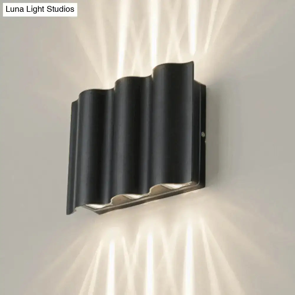 Decorbites black wavy wall sconce, metal finish, wall-mounted ambient lighting on Tampa Home & Garden Store