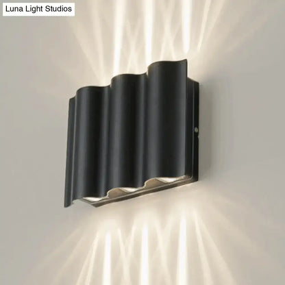 Decorbites black wavy wall sconce, metal finish, wall-mounted ambient lighting on Tampa Home & Garden Store