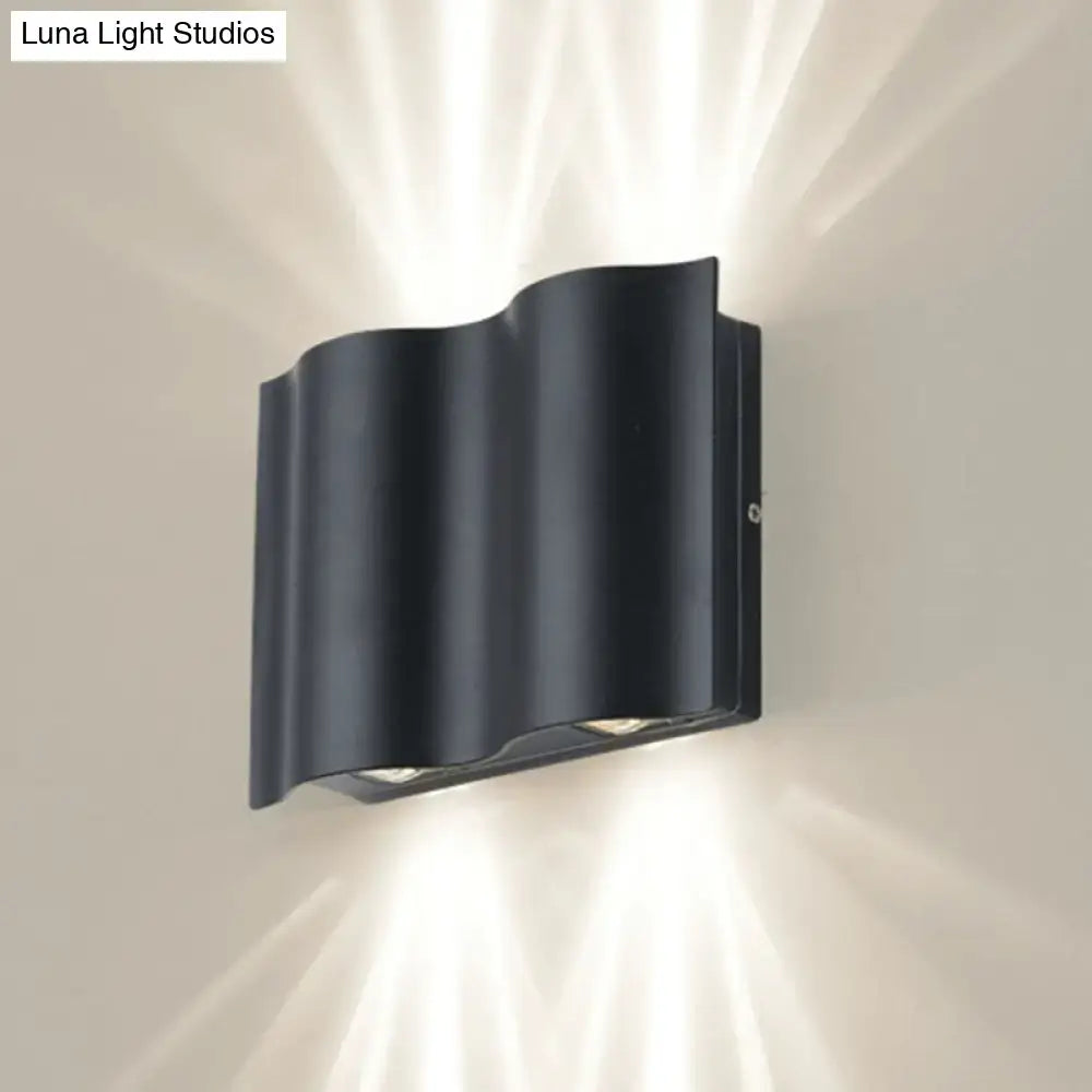 Black Wavy Wall Sconce by Decorbites, black metal wall lamp with curved wave design on Tampa Home & Garden Store