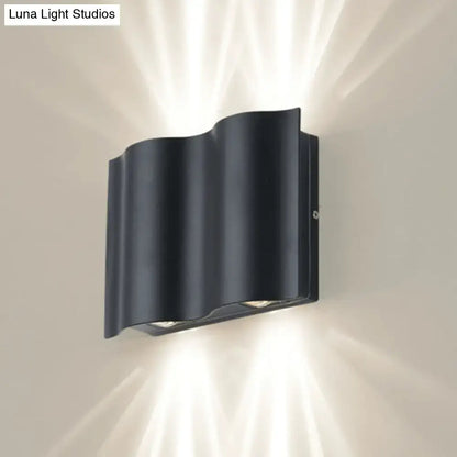 Black Wavy Wall Sconce by Decorbites, black metal wall lamp with curved wave design on Tampa Home & Garden Store