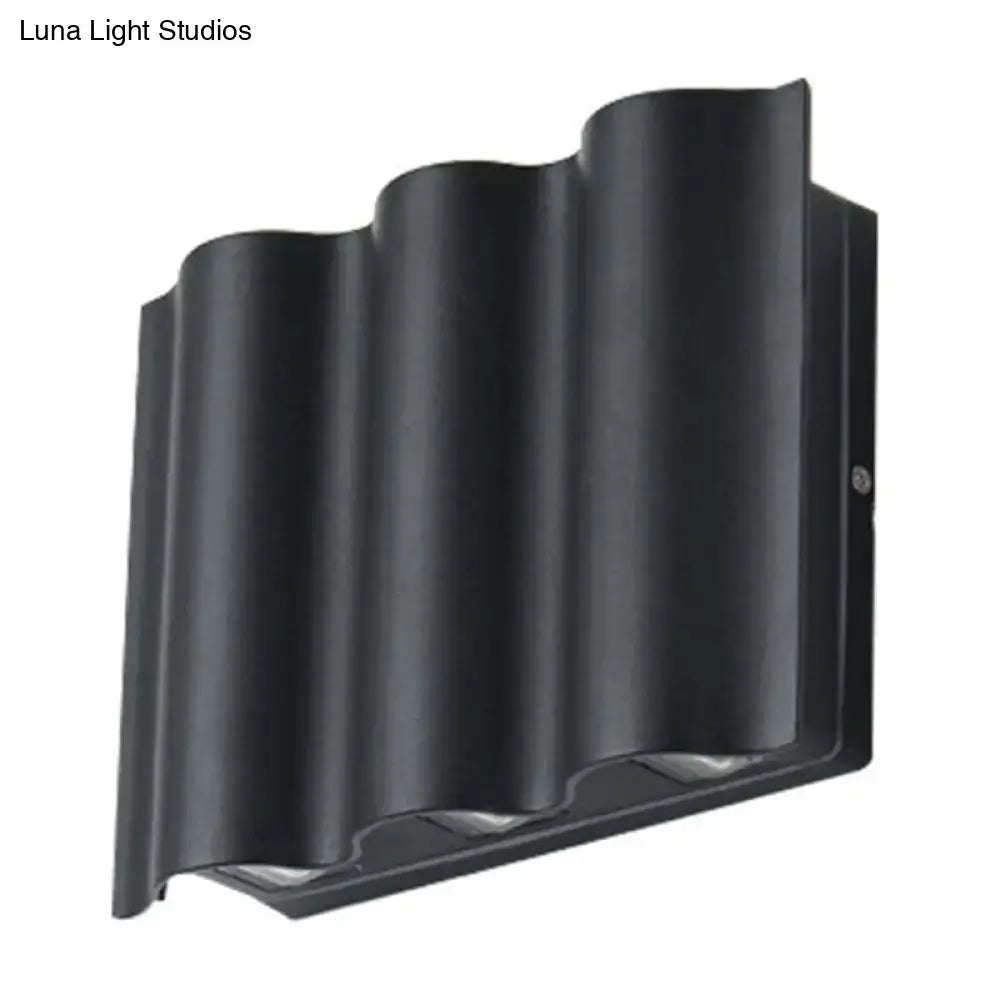Black wavy wall sconce by Decorbites with ribbed metal shade on Tampa Home & Garden Store