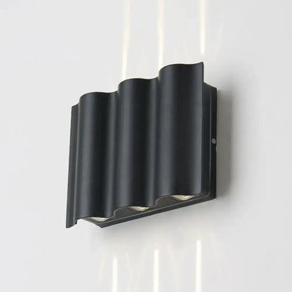 Black Wavy Wall Sconce black matte metal wave design on Tampa Home & Garden Store