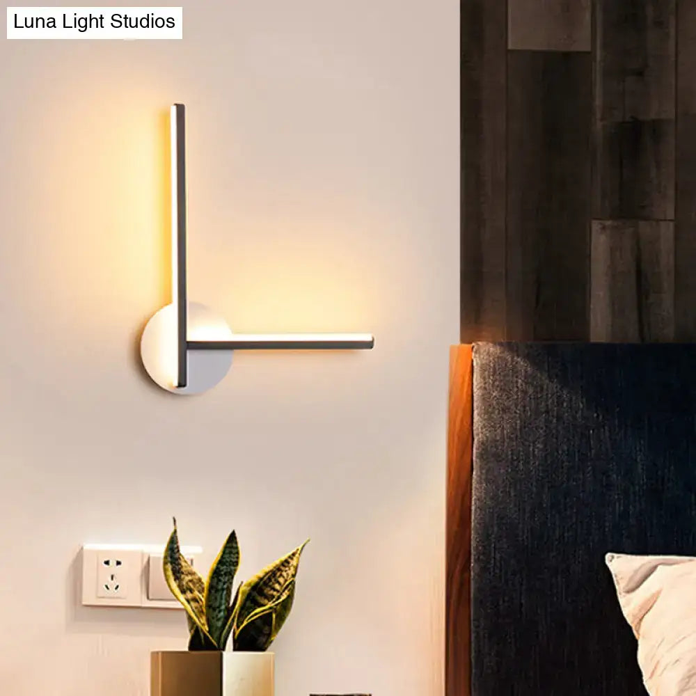 Modern cross wall sconce in black and white acrylic with warm white light by Decorbites on Tampa Home & Garden Store