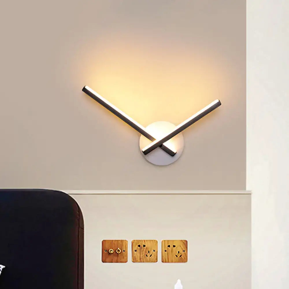 Cross wall sconce in black and white acrylic by Decorbites with warm white light on Tampa Home & Garden Store