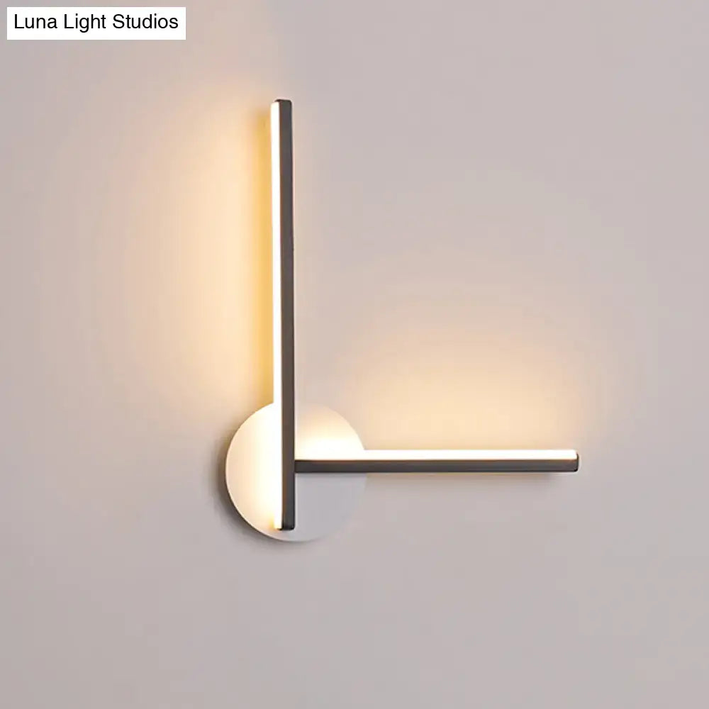 Modern black and white acrylic cross wall sconce with warm white light Decorbites on Tampa Home & Garden Store