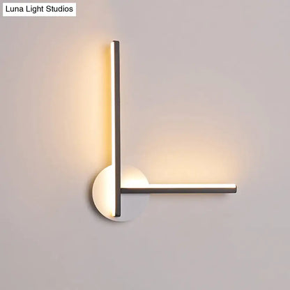Modern black and white acrylic cross wall sconce with warm white light Decorbites on Tampa Home & Garden Store