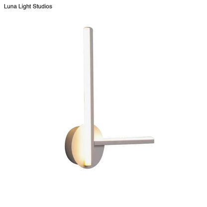 Modern black and white acrylic cross wall sconce with warm white light by Decorbites on Tampa Home & Garden Store