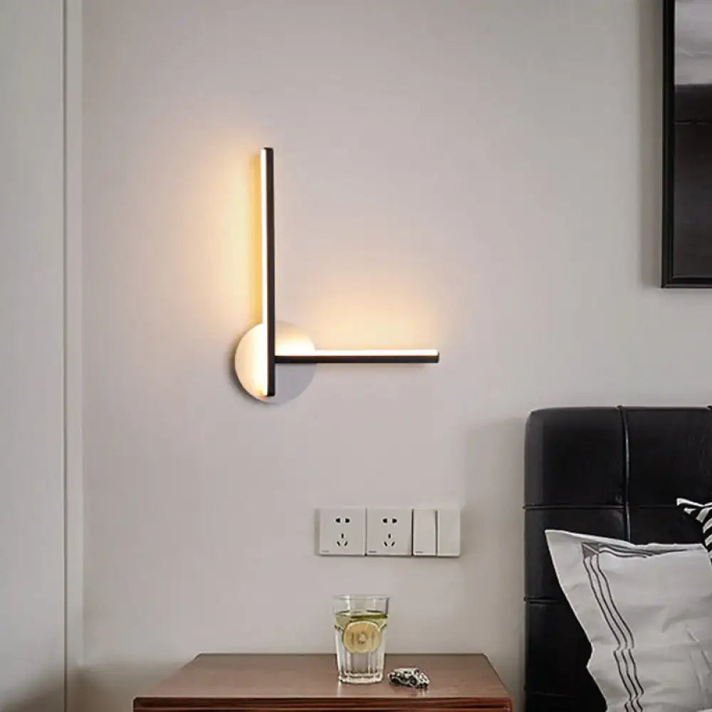 Modern black & white acrylic cross wall sconce with warm white light by Decorbites on Tampa Home & Garden Store