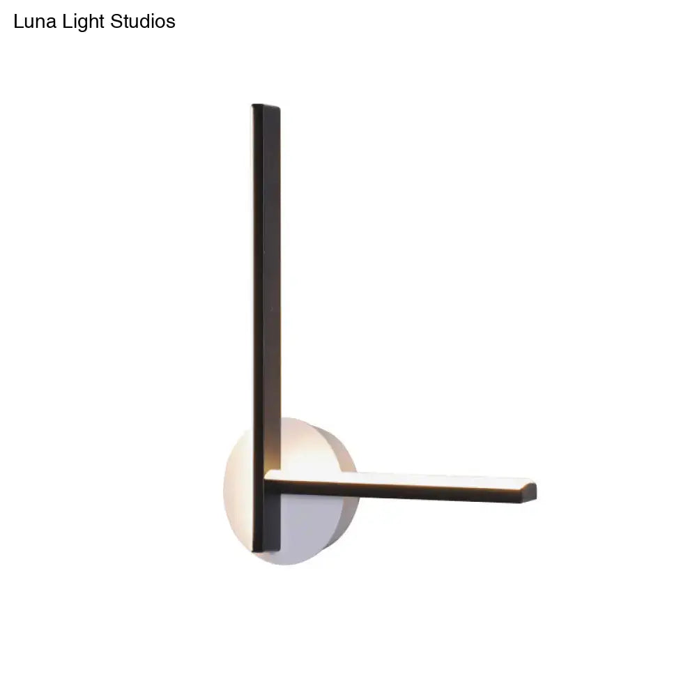 Modern black and white acrylic cross wall sconce with warm white light by Decorbites on Tampa Home & Garden Store