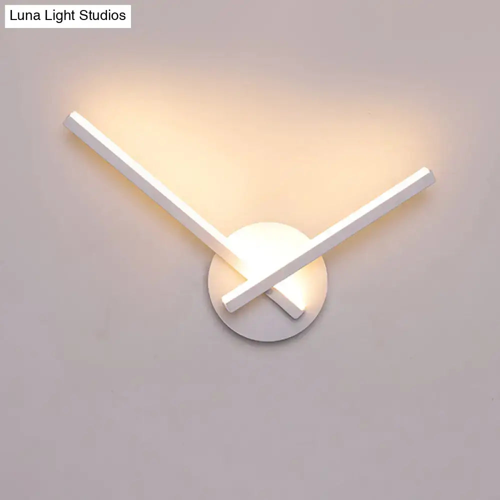 Modern black & white acrylic cross wall sconce with warm white light by Decorbites on Tampa Home & Garden Store