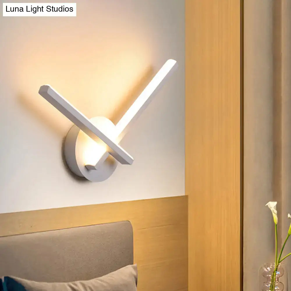 Modern black and white acrylic cross wall sconce by Decorbites with warm white light on Tampa Home & Garden Store