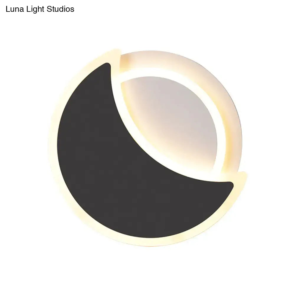 White Eclipse Wall Sconce by Decorbites with black crescent and warm halo light on Tampa Home & Garden Store