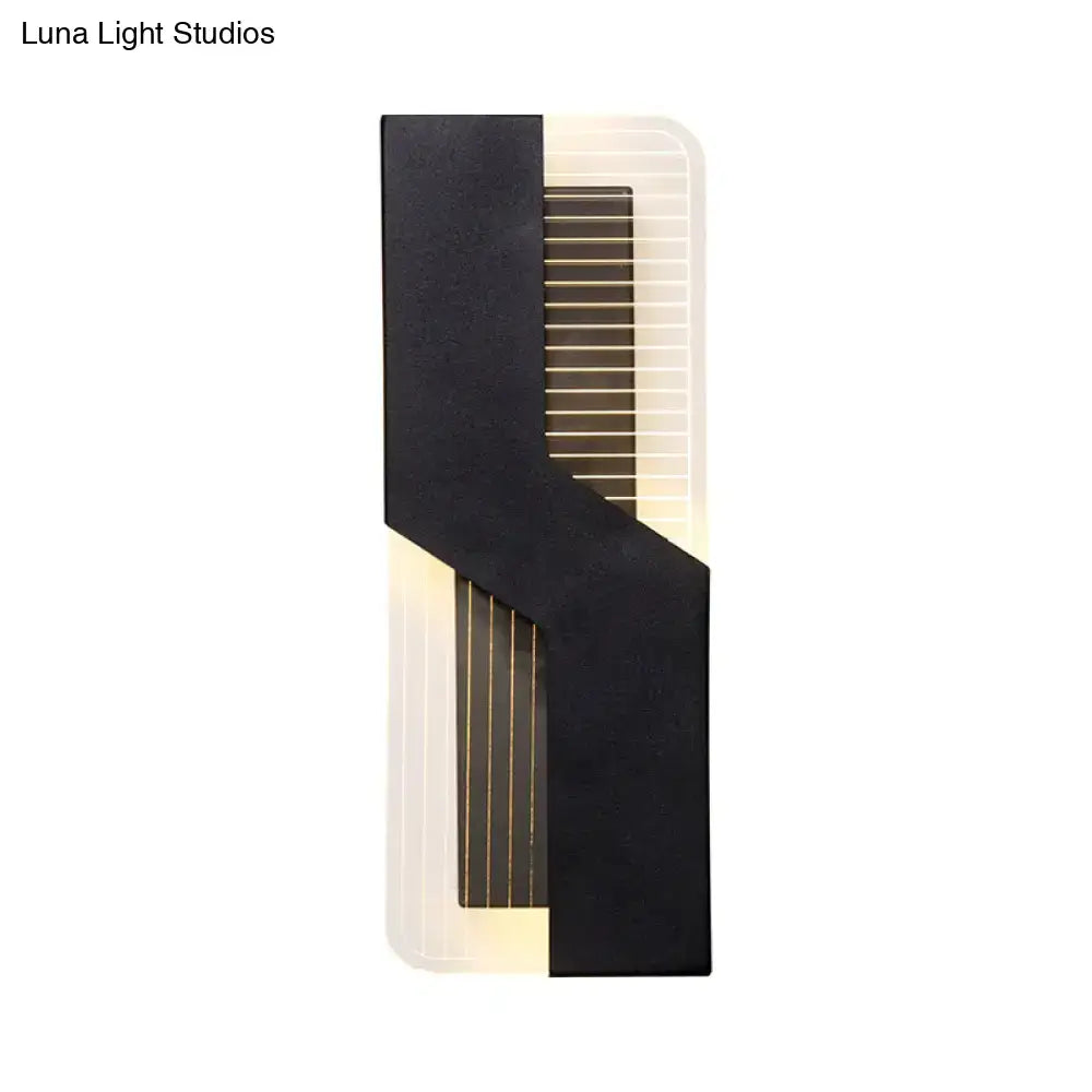 White angular wall sconce with a bold black strap over a ribbed backplate by Decorbites on Tampa Home & Garden Store