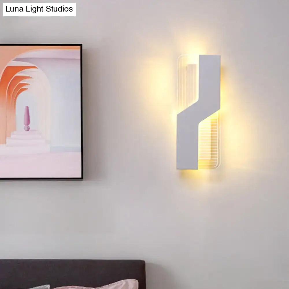 Decorbites white angular wall sconce with warm LED glow on Tampa Home & Garden Store