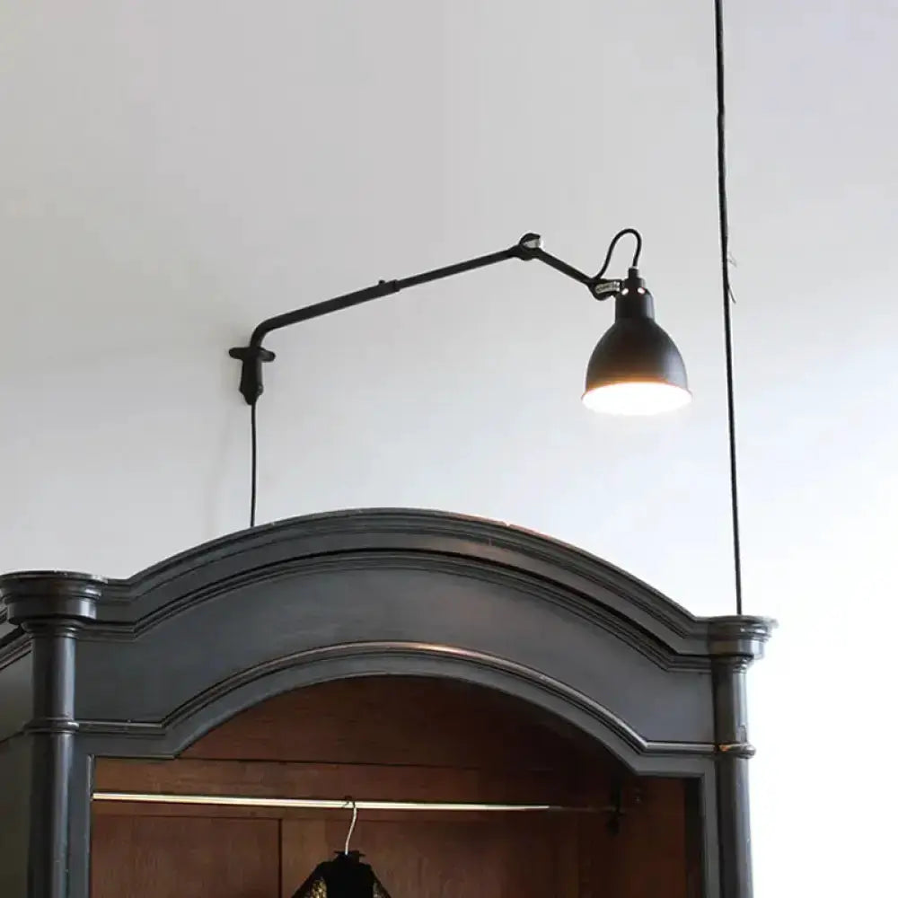 Articulated black-and-white bedroom wall lamp by Decorbites, wired power above arched headboard on Tampa Home & Garden Store