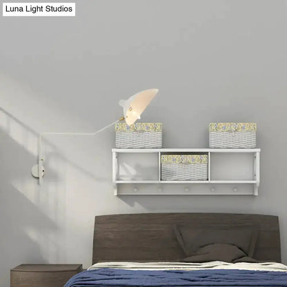 Modern white articulated wall sconce by Decorbites with adjustable arm over bed, baskets on Tampa Home & Garden Store