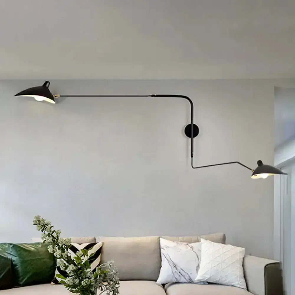 Modern black and white articulated wall sconce with dual shades by Decorbites on Tampa Home & Garden Store