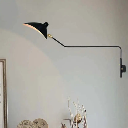 Decorbites black and white wall sconce with brass joint and adjustable arm on Tampa Home & Garden Store
