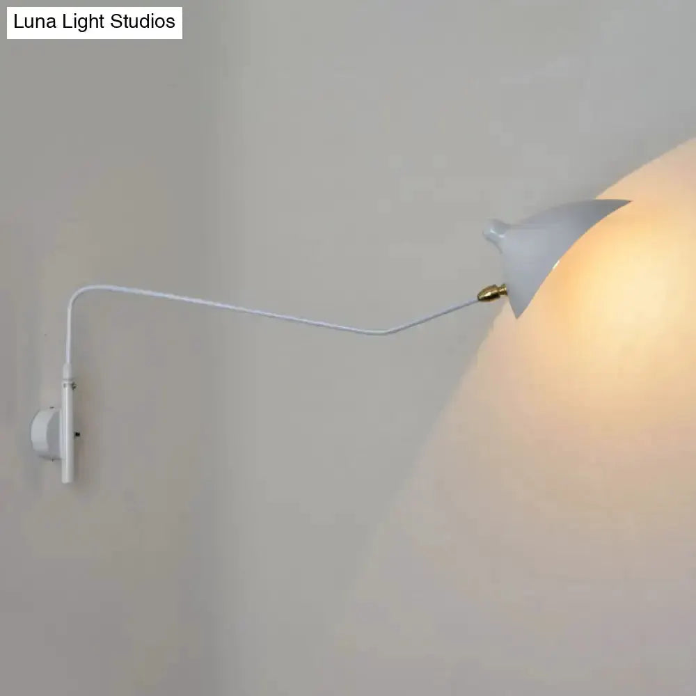 Decorbites modern articulated wall sconce with white shade and brass socket on wall on Tampa Home & Garden Store
