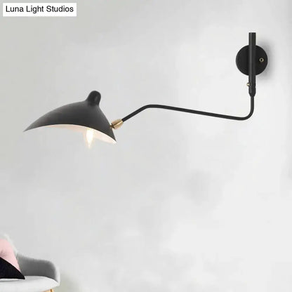 Modern black and white articulated wall sconce with adjustable arm and brass accent on Tampa Home & Garden Store