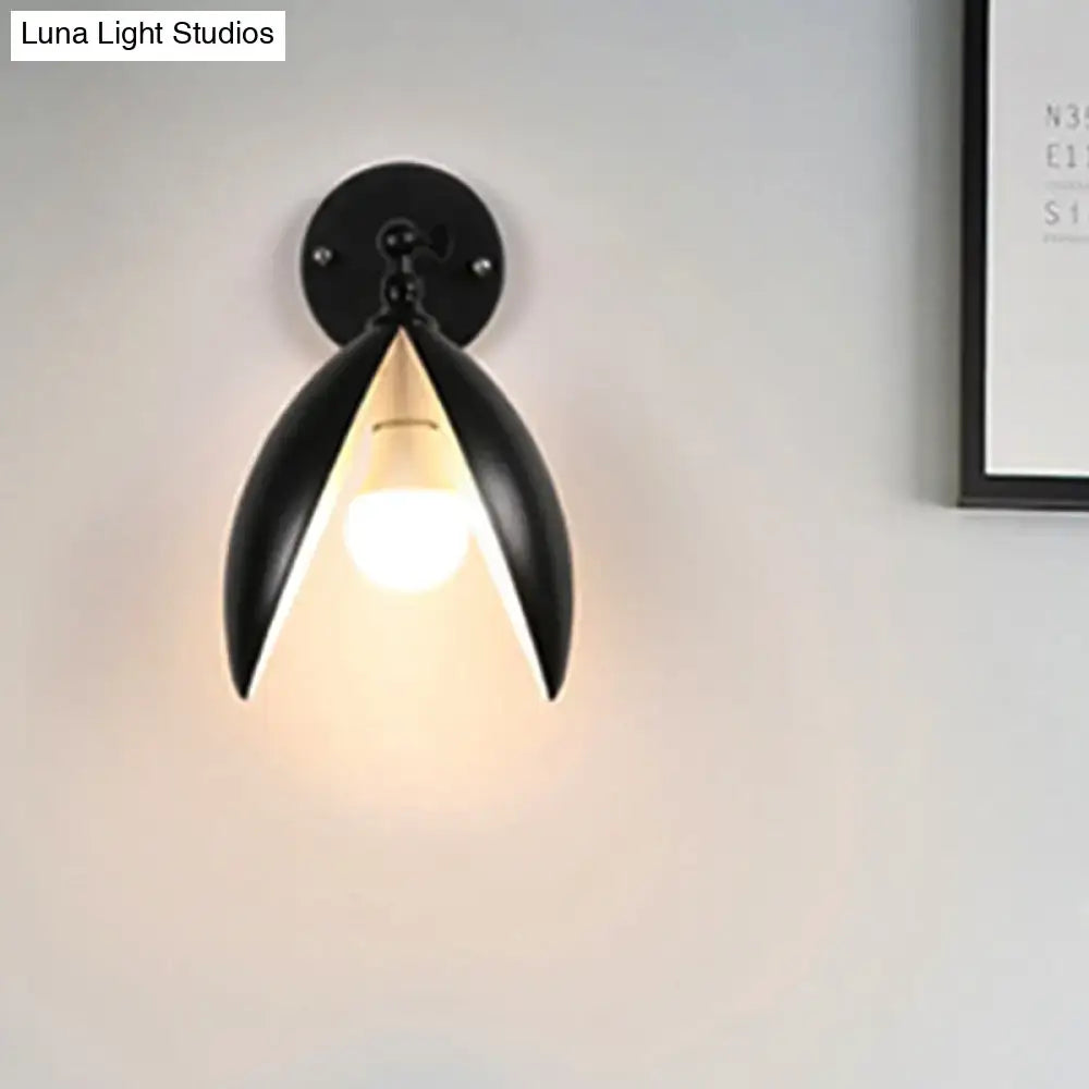 Decorbites Black Bud Wall Sconce, cast iron petal design with round backplate, warm glow on Tampa Home & Garden Store